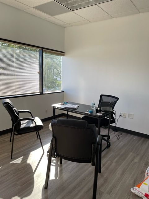 desk and chairs at maxim hair restoration in boca raton, fl